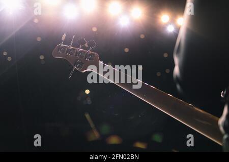 The artist plays the guitar. Rock band at a concert Stock Photo