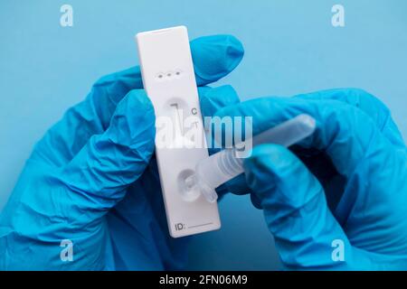Close up of a person using coronavirus covid-19 rapid antigen home testing kit Stock Photo