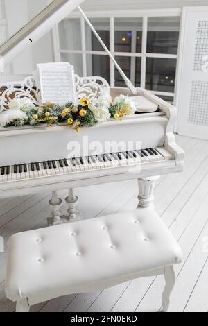 white piano in a white interior. Luxury interior Stock Photo - Alamy