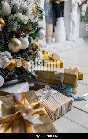Decorated gift boxes under the Christmas tree Stock Photo