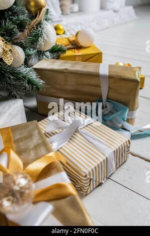 Decorated gift boxes under the Christmas tree Stock Photo
