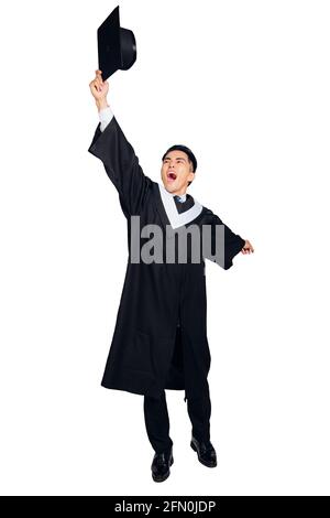Happy male  graduate student throwing the cap Stock Photo