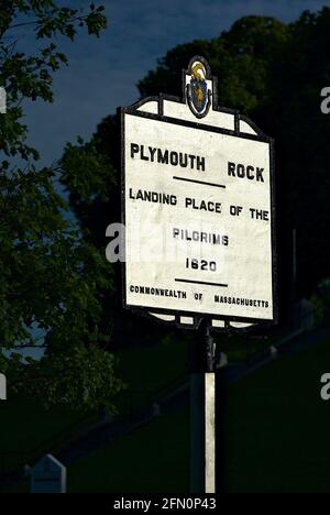 Plymouth, Massachusetts, USA - July 2, 2019: A sign for Plymouth Rock near the location where the Pilgrims of the Massachusetts Bay Colony came ashore. Stock Photo