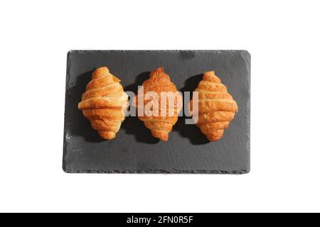 Croissant isolated in  wihite background with sunny light Stock Photo