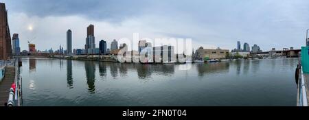 Brooklyn, New York - Apr 24, 2021: Queens and New York City skyline from Manhattan Avenue Park in Greenpoint, Brooklyn. Stock Photo