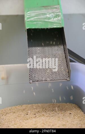 Factory machine Milling rice in close up Stock Photo