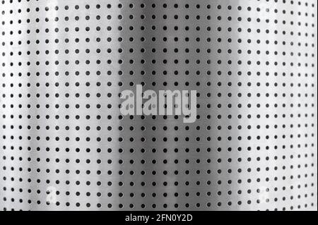 stainless steel perforated metal roll. Perforated metal pattern. Background texture of chromium or aluminium rod alignment which is decorate building Stock Photo