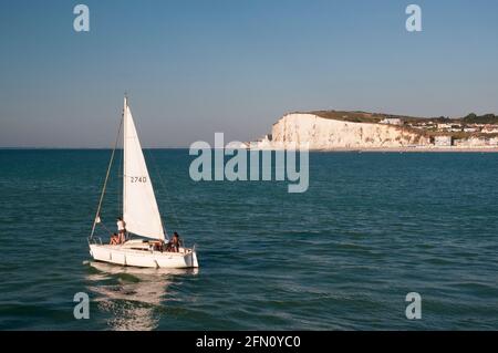 Yacht on the English Channel with cliffs and beach of Mers-les-Bains seaside resort, Somme (80), Hauts-de-France region, France Stock Photo