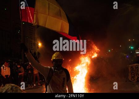 Bogota, Cundinamarca, Colombia. 12th May, 2021. The city of Bogota faces its fourteenth day of protests in the context of the national strike called by social sectors against the Colombian government of President Ivan Duque Credit: Daniel Romero/LongVisual/ZUMA Wire/Alamy Live News Stock Photo