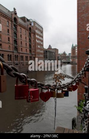 Locks on a bridge in Hamburg for lovers and strong relationships. Stock Photo