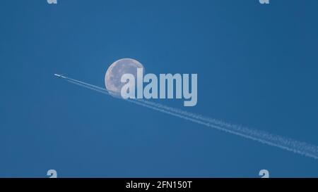 Germany Dortmund 29.9.18 Lufthansa plane in the sky flies next to the moon Stock Photo