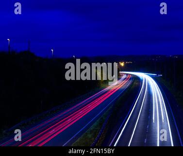 light trails on main road Stock Photo