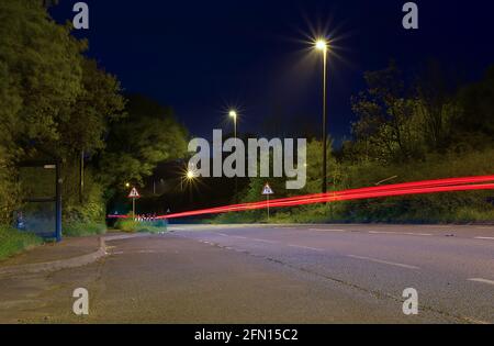 light trails on main road Stock Photo