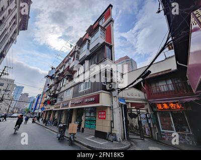 Shanghai,  China. 13th May, 2021. On May 12, 2021, Shanghai, in the afternoon, near Shitan Lane, Ningbo Road, Huangpu District, the famous ''Paper House'' looks particularly imposing in the sun, as if it is standing on the street, holding a sharp blade against the sky The ''Blade Warrior''. On December 4, 2013, the British ''Daily Mail'' paid attention to this building on Ningbo Road, Shanghai, and stated that it may be the flat and thinnest building in the world. The thinnest part of the outer wall of this triangular building is said to be only more than 20 centimeters. Credit: ZUMA Press, In Stock Photo