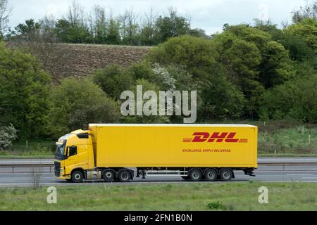 A DHL lorry on the M40 motorway, Warwickshire, UK Stock Photo