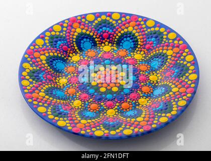 Pink decorative plate with a pattern in the style of a mandala Stock Photo