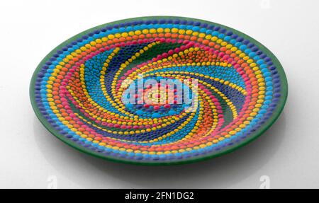 Pink decorative plate with a pattern in the style of a mandala Stock Photo