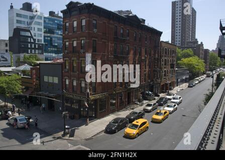 NEW YORK CITY, UNITED STATES - May 25, 2015: Urban: Traffic with yellow cabs between skyscrapers on Streets of New York City - USA Stock Photo