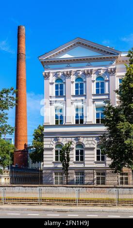 Warsaw, Poland - July 26, 2020: South wing of historic building of Warsaw Polytechnics technical university with vintage chimney in Srodmiescie Stock Photo