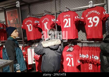 Official Manchester United Merchandise on sale at the Manchester United Megastore at Old Trafford Stadium in Manchester, UK. December 2019. Stock Photo