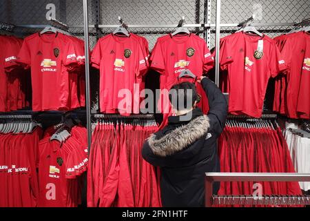 Official Manchester United Merchandise on sale at the Manchester United Megastore at Old Trafford Stadium in Manchester, UK. December 2019. Stock Photo