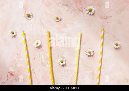 Paper straws on pastel pink summer background Stock Photo