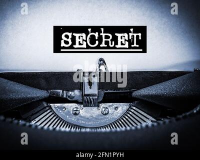 Secret written on a typewriter underline text with a black border Stock Photo