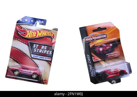 ISTANBUL, TURKEY - Dec 20, 2020: Istanbul, Turkey - December 20, 2020: A Hot Wheels Chevy Camaro diecast toy car and a Majorette Nissan Concept toy ca Stock Photo