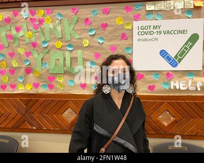 WOMAN GETS MODERNA VACCINE DURING COVID-19 PANDEMIC. Stock Photo