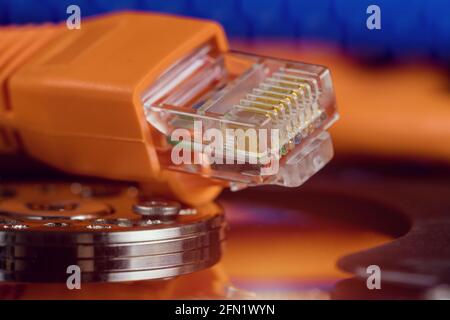 Selective focus at internet network cables connected with online storage files backup, transfer, server information storage Stock Photo