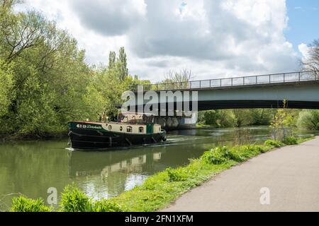 Riverboat boat passing under Donnington Bridge on the River