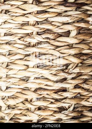 Wicker crafts basket background with shadows. Natural texture background. Stock Photo