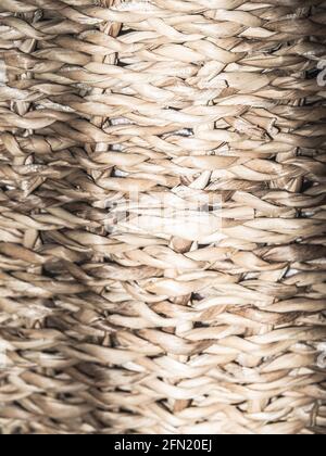 Wicker crafts basket background with shadows. Natural texture background. Stock Photo