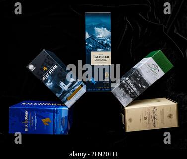 Display of Scotch malt whisky box brands, Scotland, UK: Kilchoman, Islay Storm, Talisker, Tobermory & Dalwhinnie whiskies