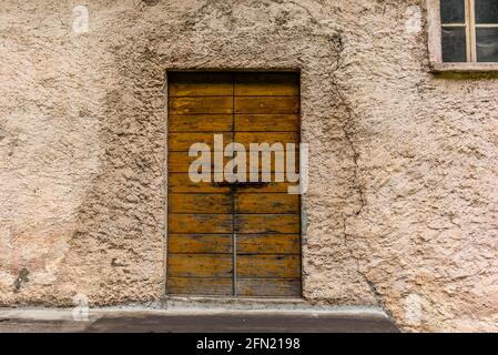 Old door of a farmhouse in Valposchiavo Stock Photo