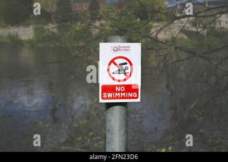 Scottish Borders Council No Swimming sign beside the River Tweed in Kelso, Roxburghshire, Scottish Borders, Scotland, UK. Stock Photo