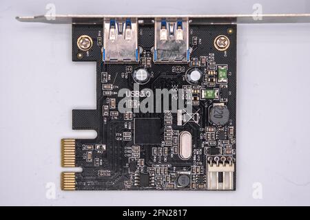 Computer PCI-E to USB 3.0 Expasion Card on white background. PCI-Express card for connectors additional USB 3.0, isolated on white  background. Stock Photo