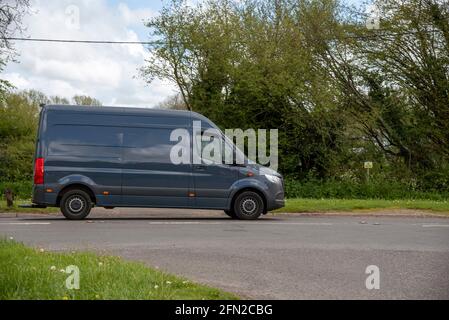 Hampshire, England, UK. 2021. Blue coloured commercial van driving along a main road in Hampshire, UK. Stock Photo