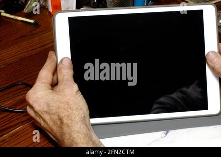 A Person Holding a Tablet Getting Ready to Browse the Internets Stock Photo