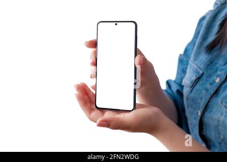 Woman holding smart phone in front, vertical position and show isolated display for app design presentation. Isolated background Stock Photo
