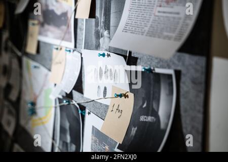 Police Investigation Board And Crime Victim Information Stock Photo