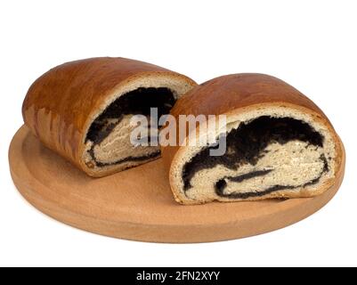 Two halves of a roll with poppy on a round wooden board Stock Photo