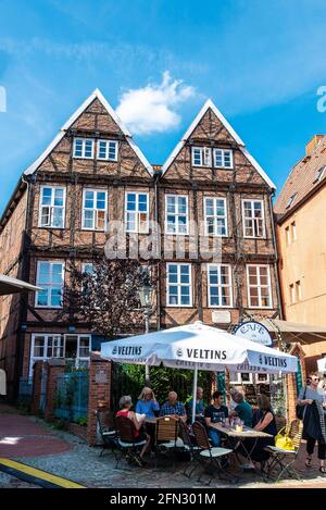 Hansestadt Stade, Germany - August 22, 2019: Terrace of a bar with people drinking in Hansestadt Stade, Lower Saxony, Germany Stock Photo