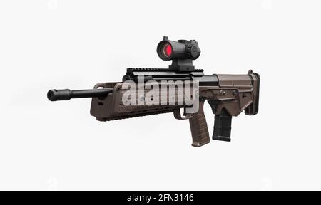 A modern automatic bullpup carbine with a telescopic sight. Weapons for defense and attack. Arming the police, special units and the army. Isolate on Stock Photo