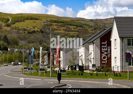 Merthyr Vale, Wales - May 2021: New detached homes on a housing development near Merthyr Tydfil. The houses are built on the site of an old colliery. Stock Photo