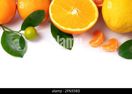 Ripe tangerines with leaves on a white background. Stock Photo