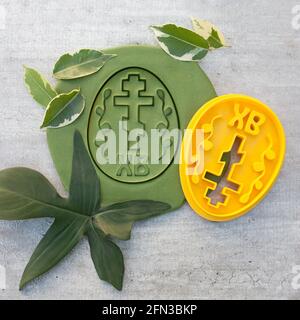 cookie cutter for cutting Easter biscuits on dough for kids Stock Photo