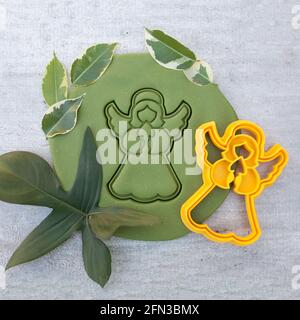 cookie cutter for cutting Easter biscuits on dough for kids Stock Photo