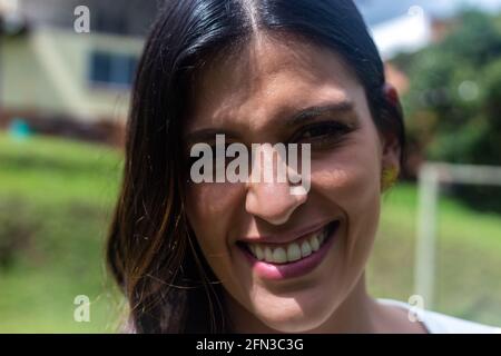 Portrait of a smiling young Latin female Stock Photo