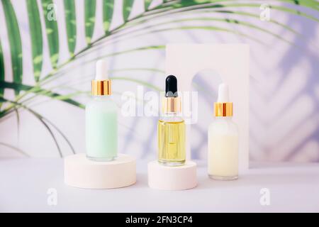 Serum or essential oil bottles and lotions on light background. Natural organic cosmetic Stock Photo